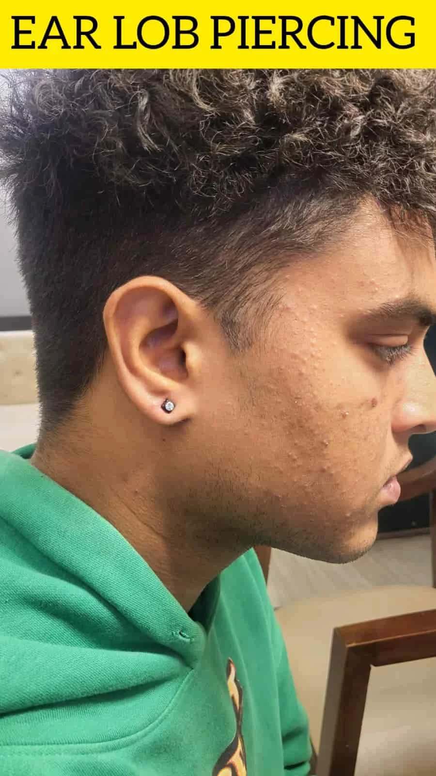 Man wearing stud jewellery after ear lobe piercing in Palam, Delhi